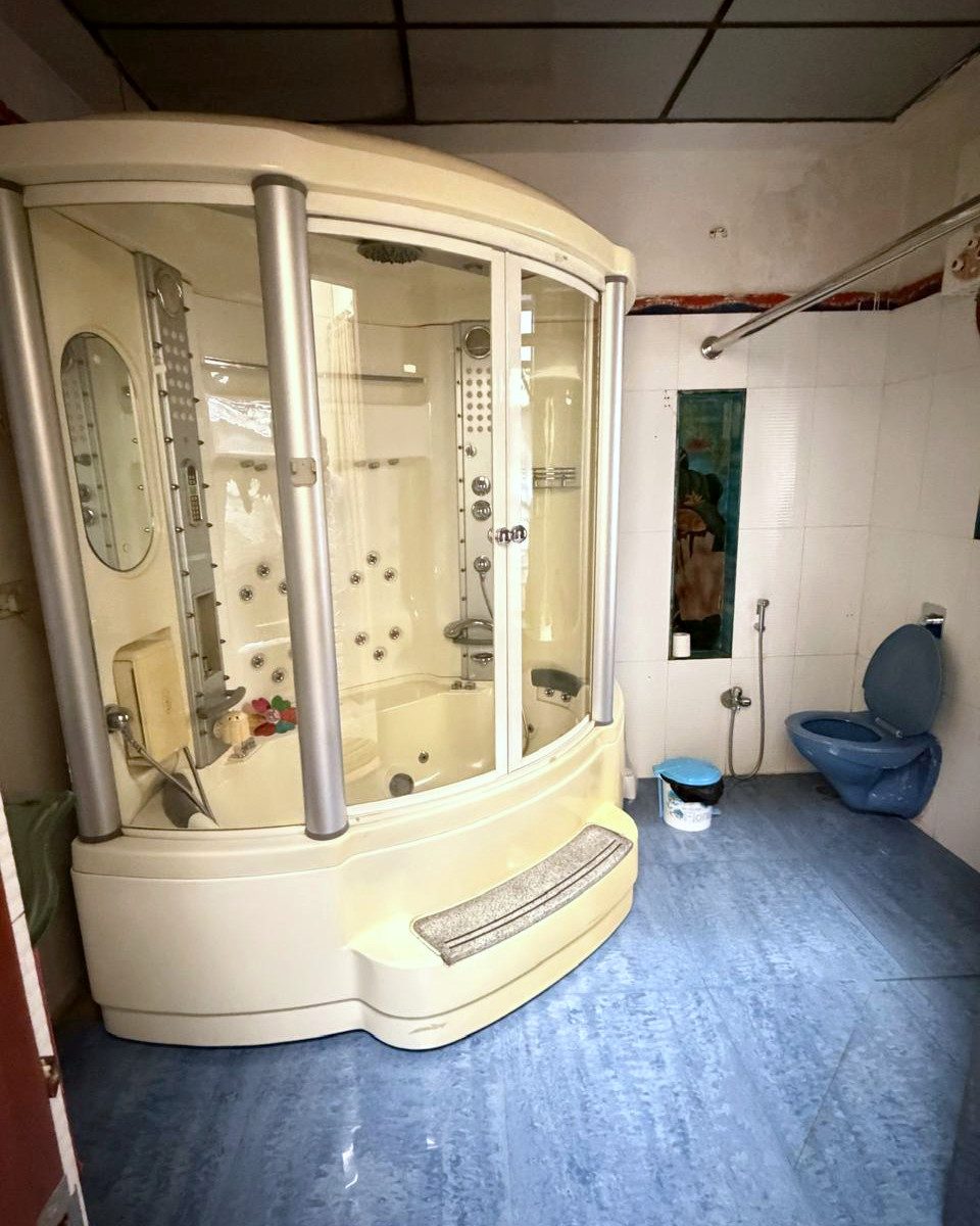 A jacuzzi and steam shower unit in one of the bathrooms